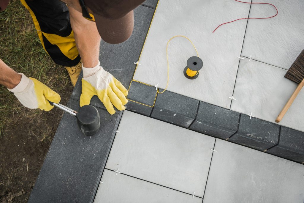 landscaper building residential patio made from co 2022 12 16 11 45 20 utc 1 scaled 1