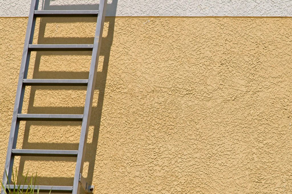 minimalist view of a yellow stucco wall with a met 2022 10 31 09 26 00 utc scaled 1