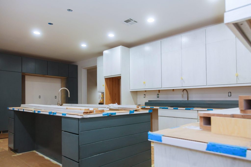 cabinet installing hardware on new kitchen cabinet 2022 11 12 11 06 13 utc scaled 1